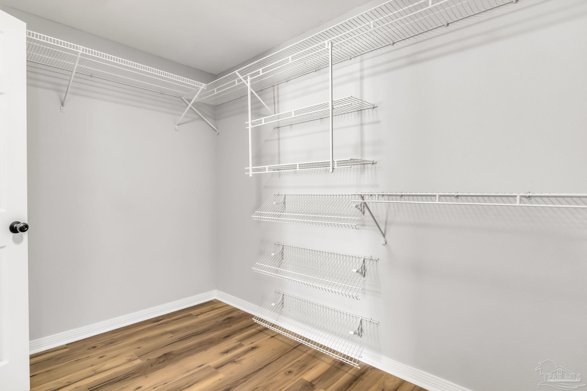 6357 Shady Lane Milton, FL 32570 - Photo 22 of 57 a view of an empty walk in closet