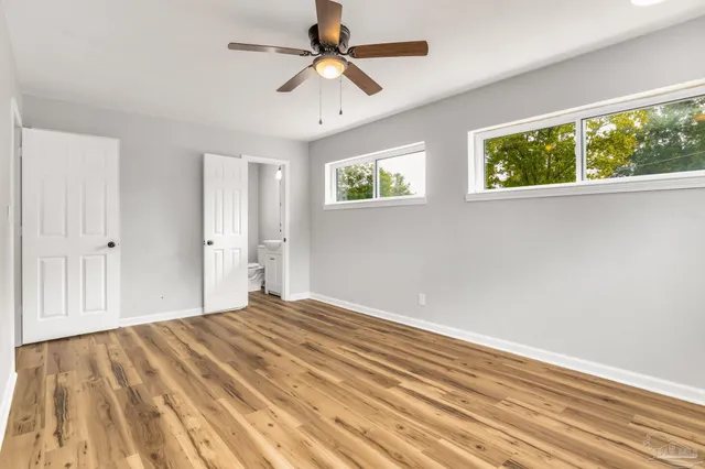 a view of an empty room with a window