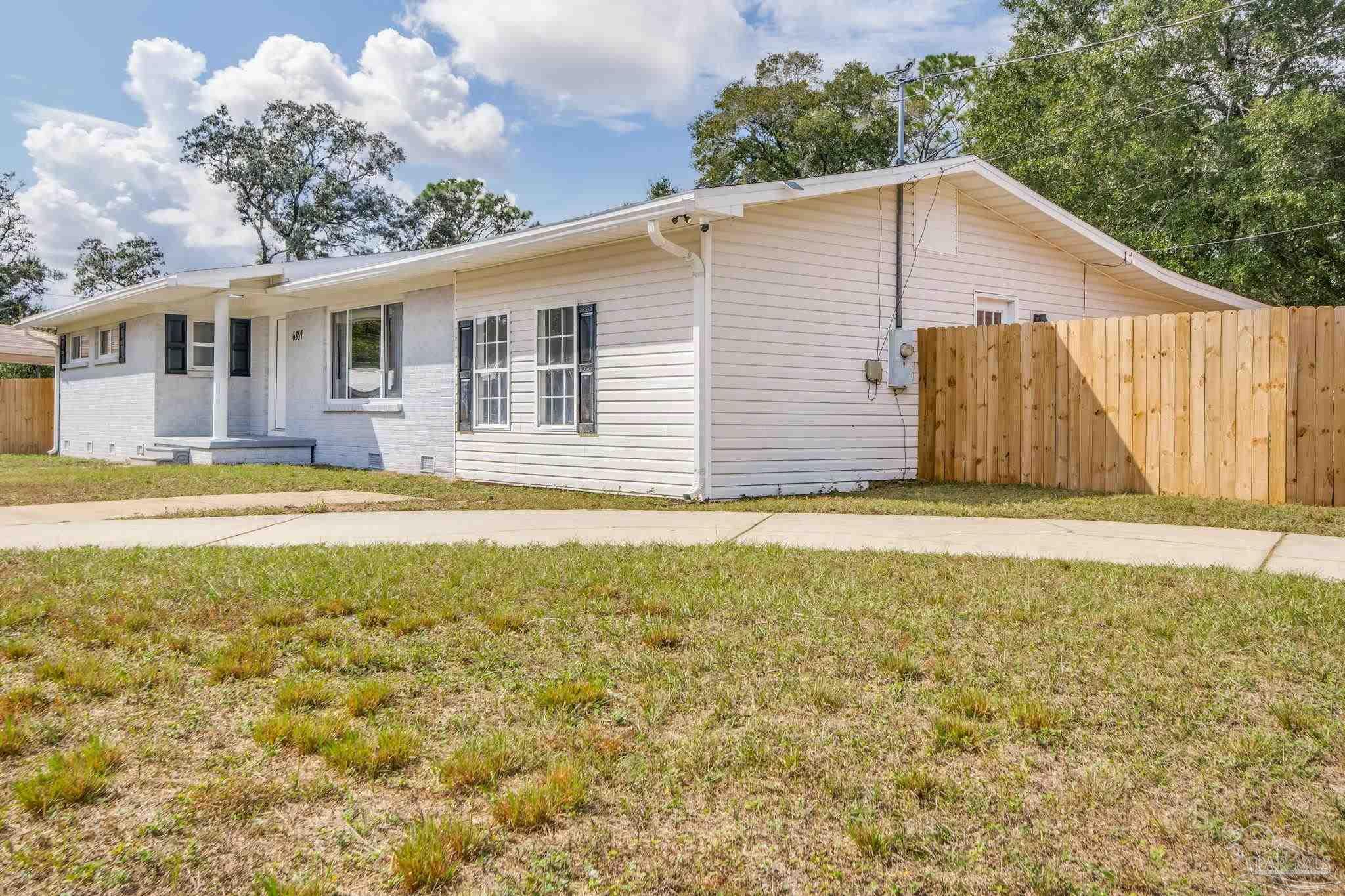 6357 Shady Lane Milton, FL 32570 - Photo 3 of 57 a view of a house with a yard