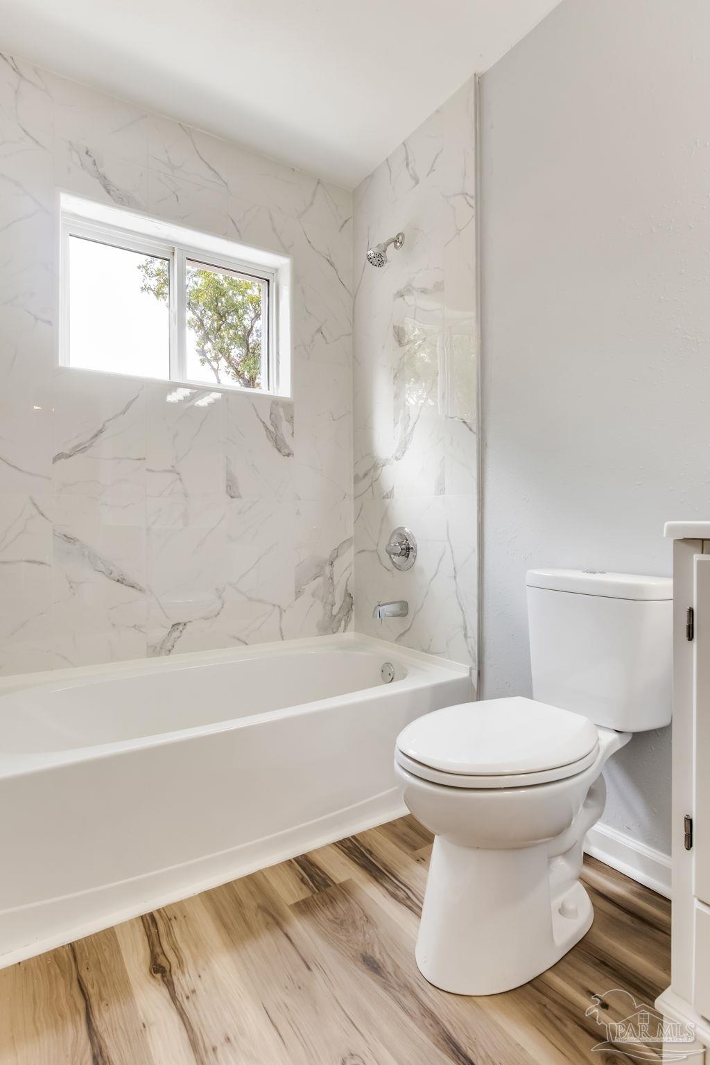 6357 Shady Lane Milton, FL 32570 - Photo 41 of 57 a bathroom with a toilet and a bathtub