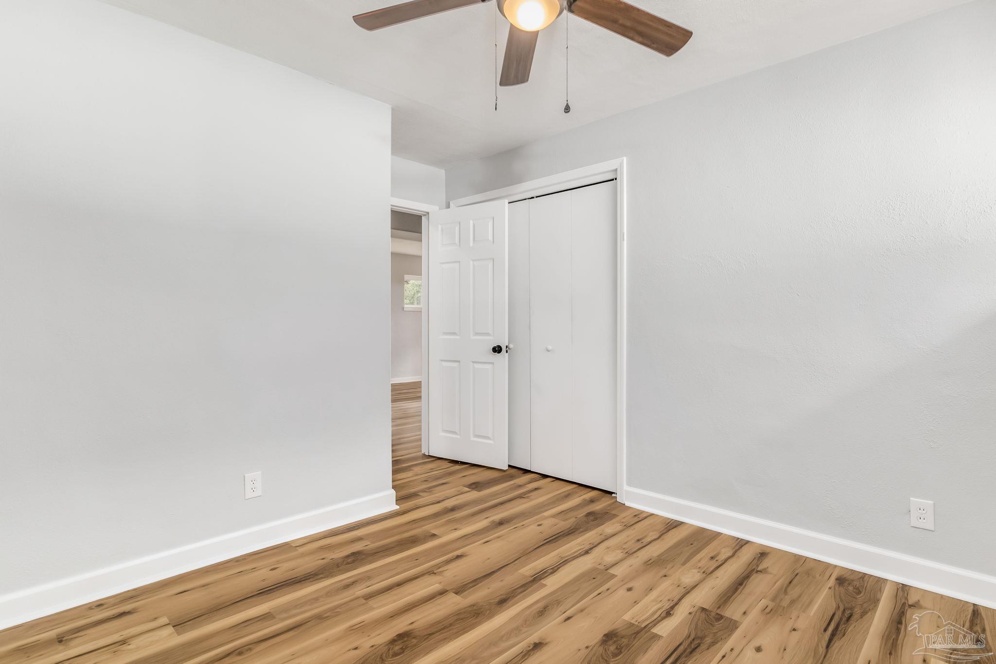 6357 Shady Lane Milton, FL 32570 - Photo 42 of 57 wooden floor in an empty room