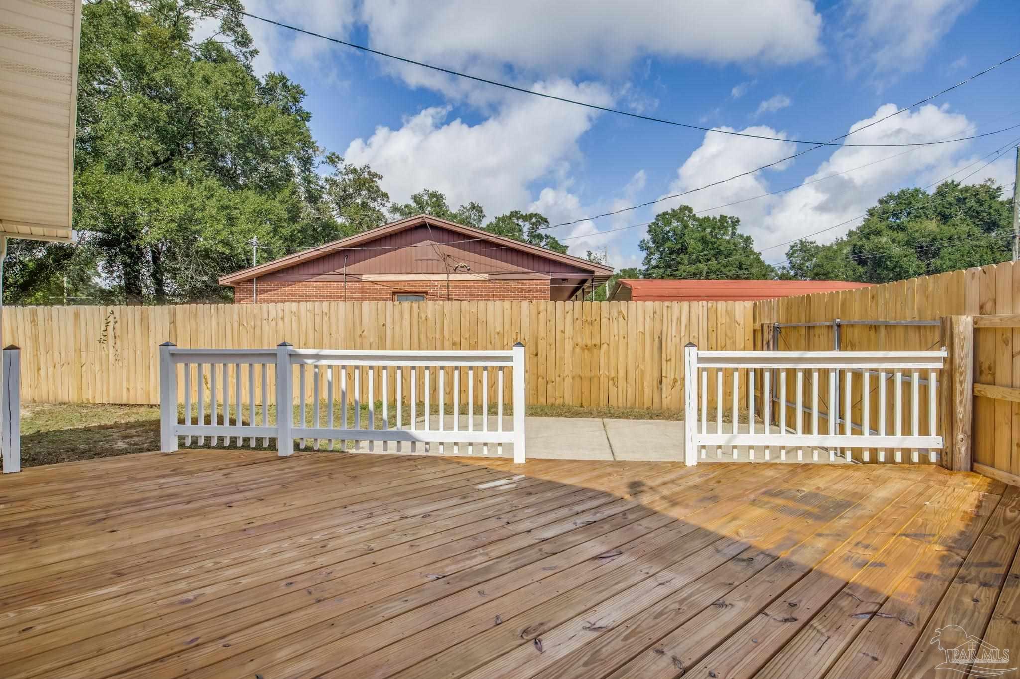6357 Shady Lane Milton, FL 32570 - Photo 46 of 57 a view of a wooden deck