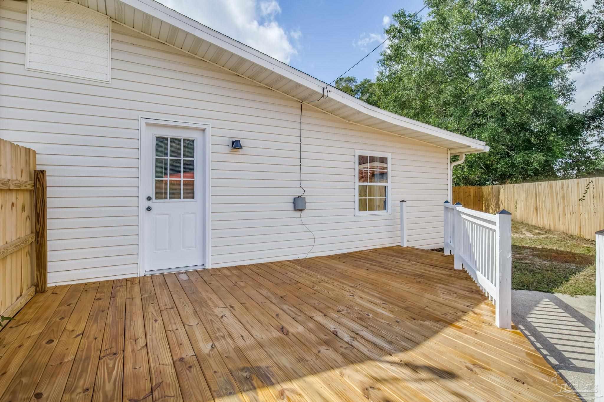 6357 Shady Lane Milton, FL 32570 - Photo 47 of 57 a view of a house with a backyard