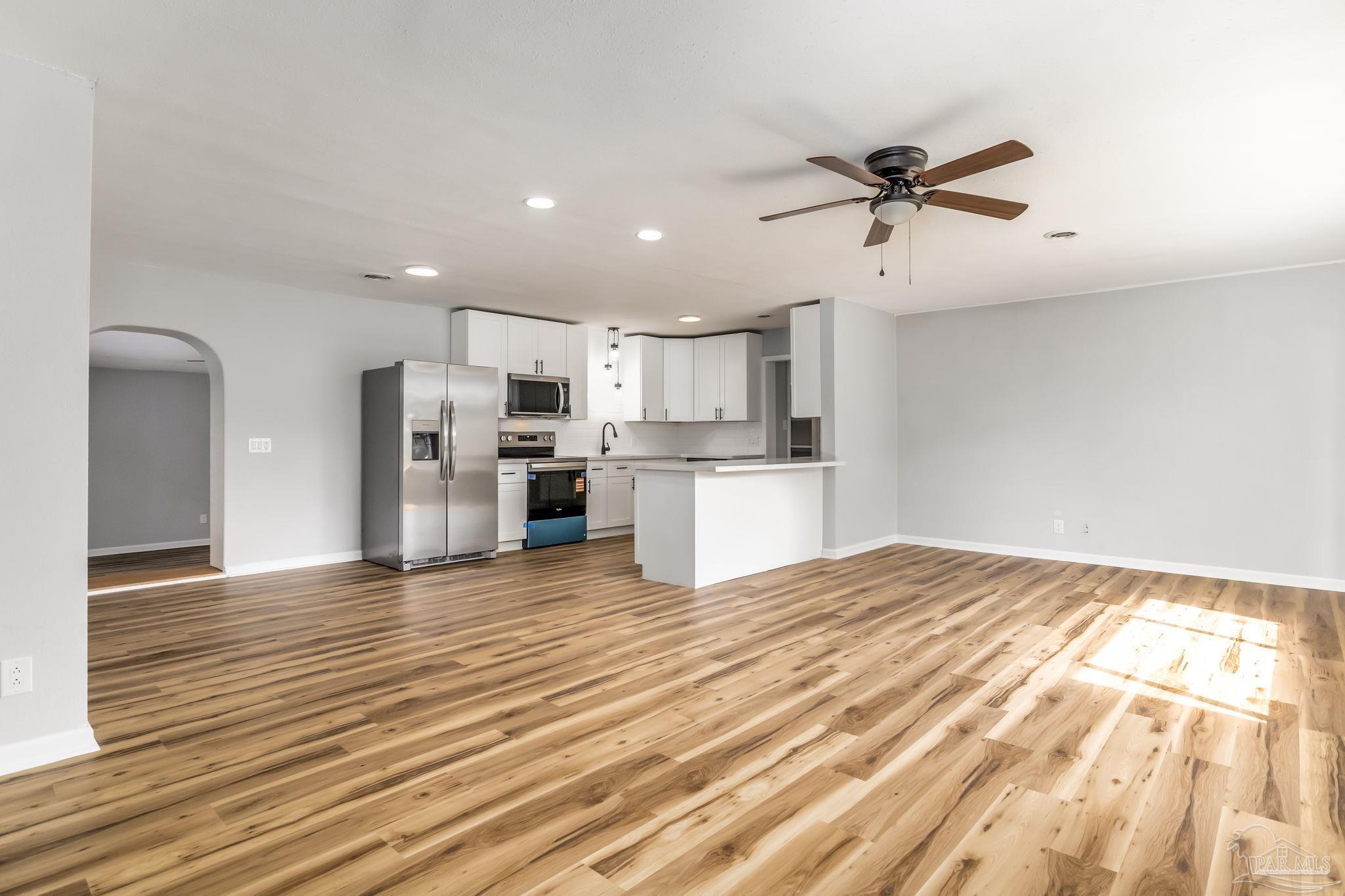 6357 Shady Lane Milton, FL 32570 - Photo 7 of 57 a view of a kitchen with a refrigerator and a window