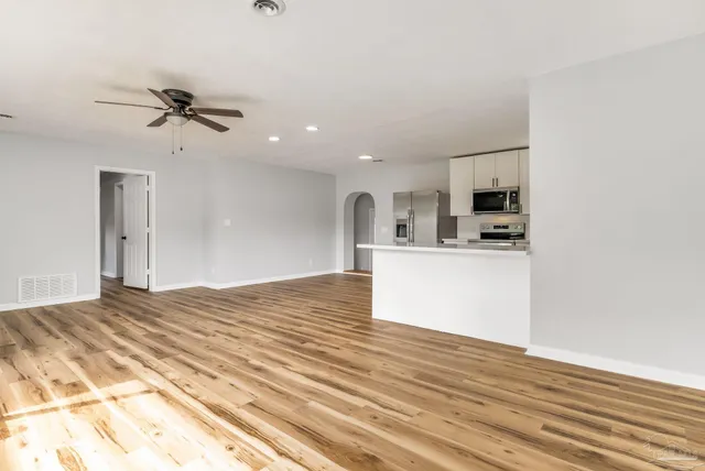 a view of a kitchen with a sink and cabinets
