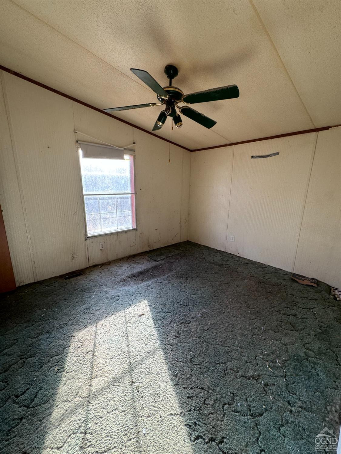 9 Leanne Road Catskill, NY 12414 - Photo 6 of 16 an empty room with windows and fan