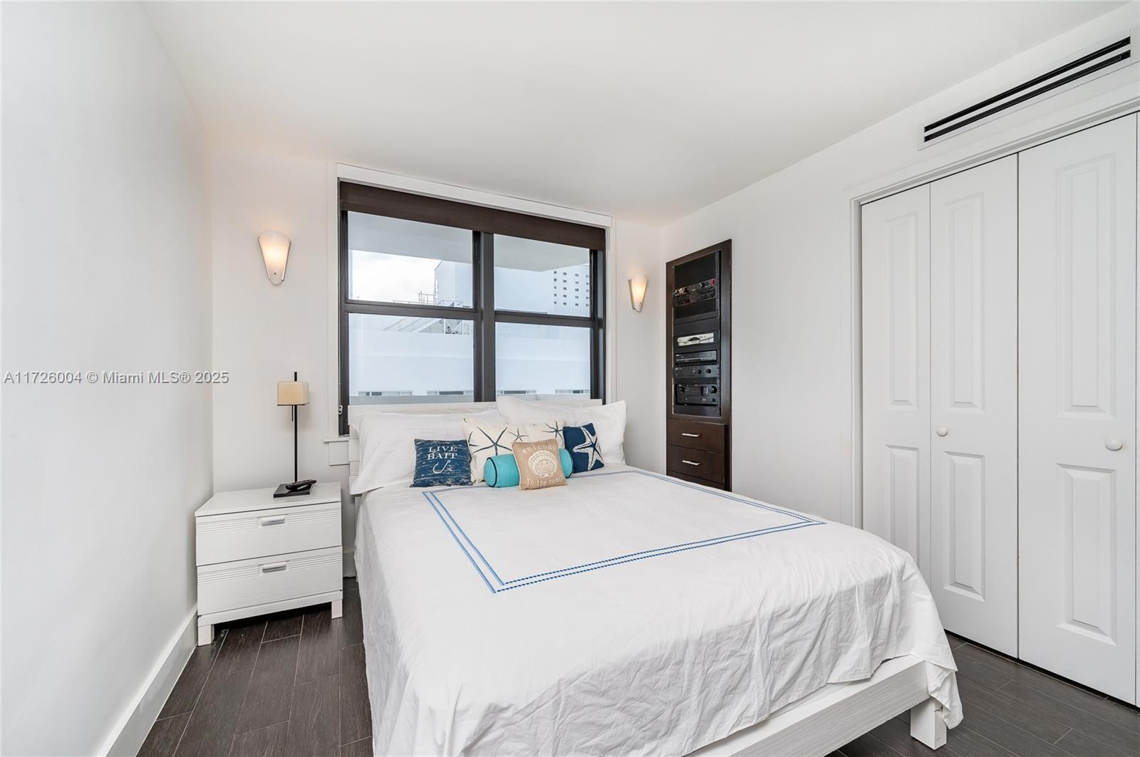 4301 Collins Avenue, Unit 1003 Miami Beach, FL 33140 - Photo 14 of 37 a bed room with a bed and a window