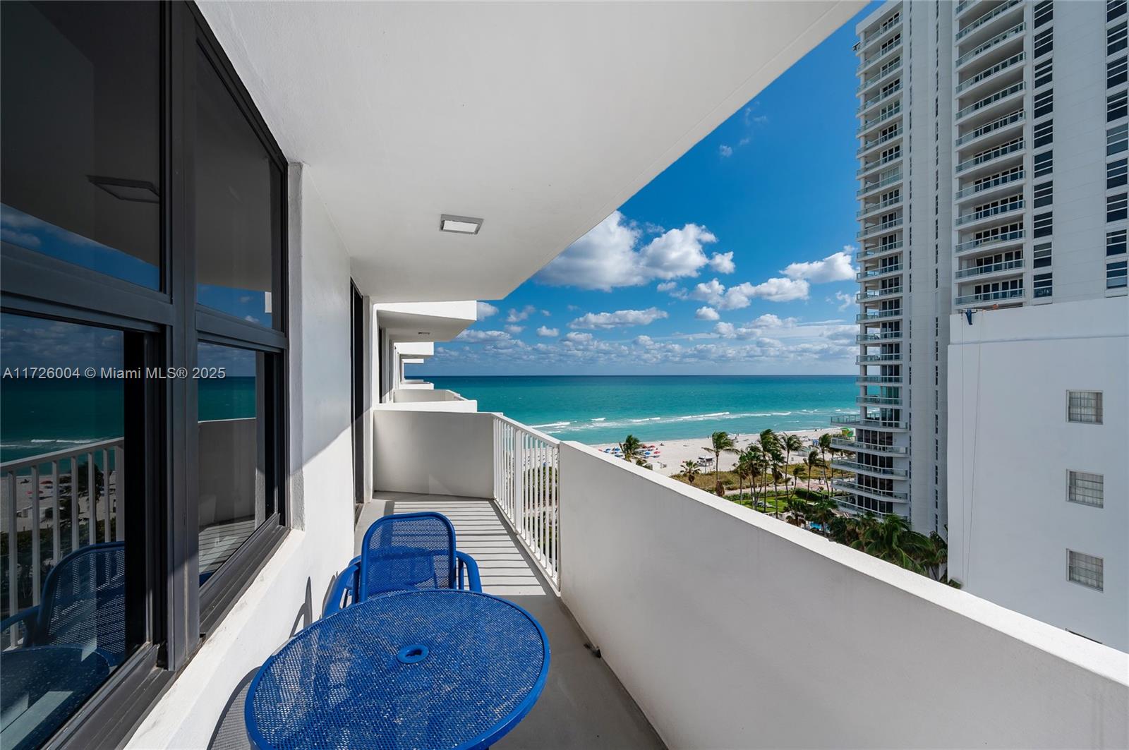 4301 Collins Avenue, Unit 1003 Miami Beach, FL 33140 - Photo 17 of 37 a view of a balcony dining table and chairs