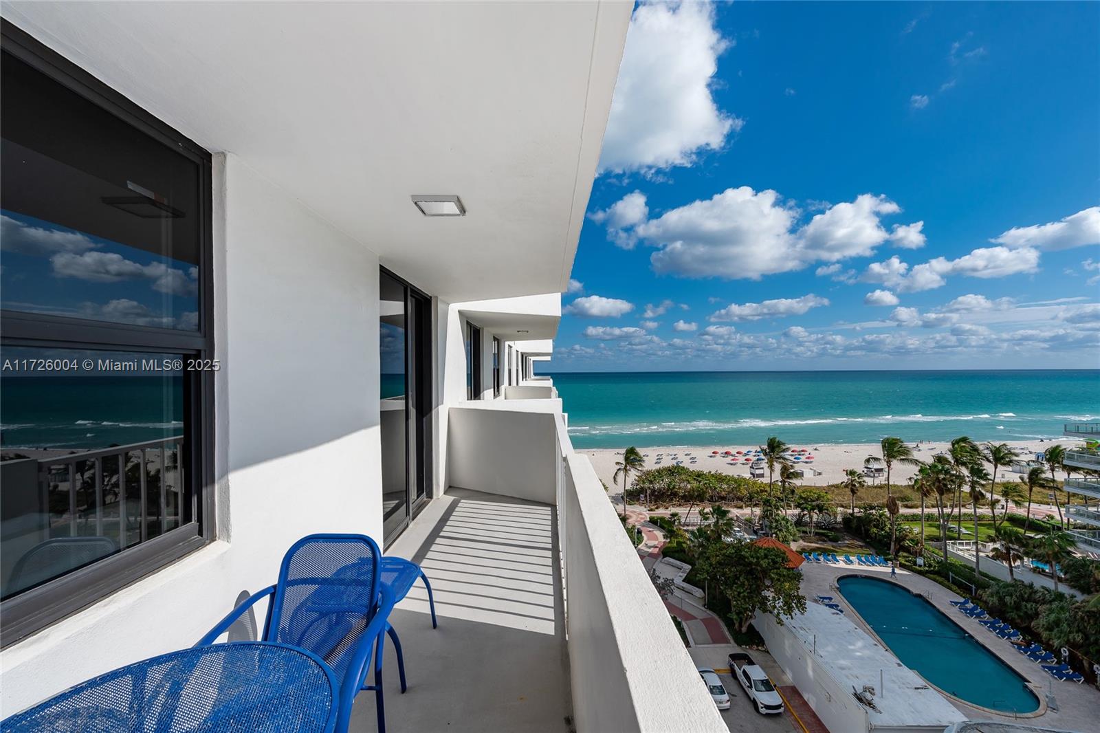 4301 Collins Avenue, Unit 1003 Miami Beach, FL 33140 - Photo 18 of 37 a view of a chairs and table in a balcony