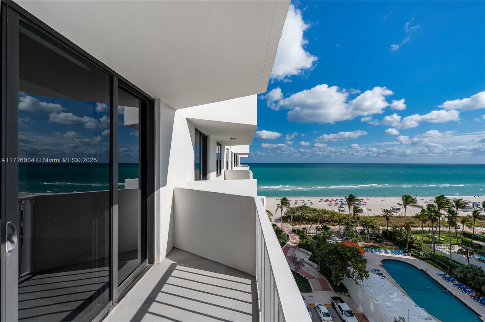 4301 Collins Avenue, Unit 1003 Miami Beach, FL 33140 - Photo 19 of 37 a view of a balcony with two chairs