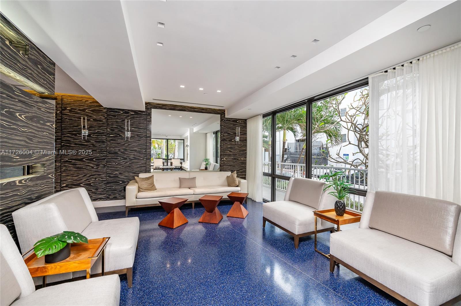 4301 Collins Avenue, Unit 1003 Miami Beach, FL 33140 - Photo 32 of 37 a living room with patio furniture and a large window