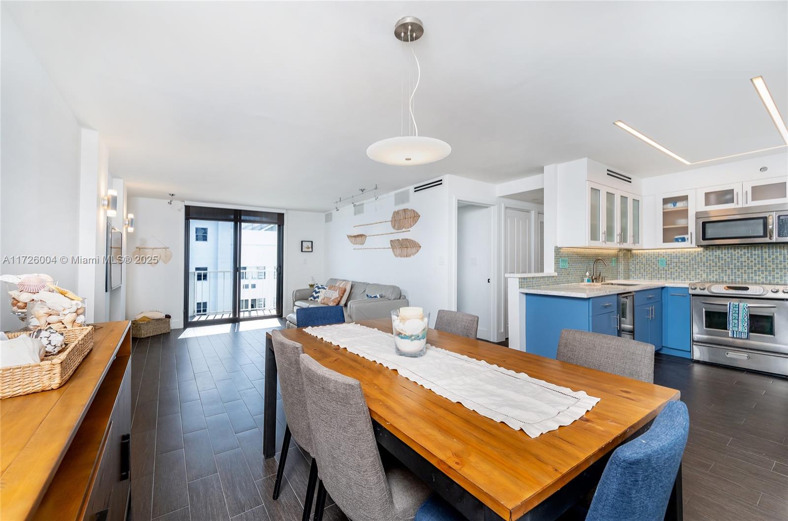 4301 Collins Avenue, Unit 1003 Miami Beach, FL 33140 - Photo 6 of 37 a living room with stainless steel appliances granite countertop furniture and kitchen view