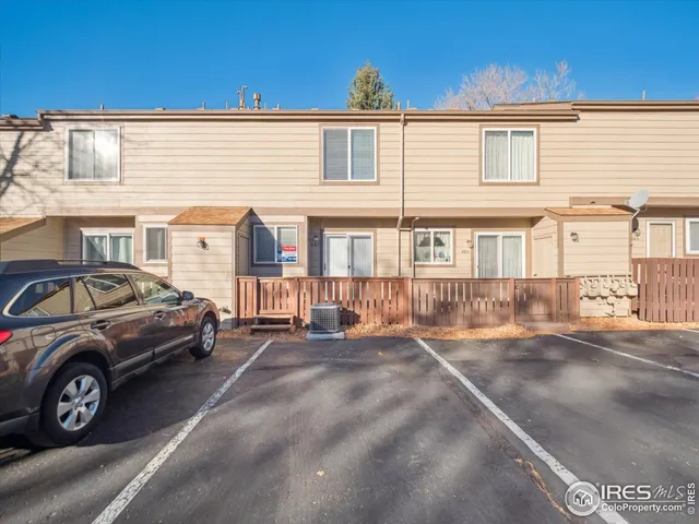 a view of a car park in front of a building