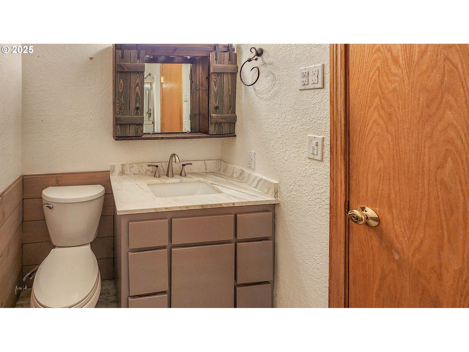 6649 Garden Valley Road Roseburg, OR 97471 - Photo 29 of 44 a bathroom with a sink a toilet and a mirror