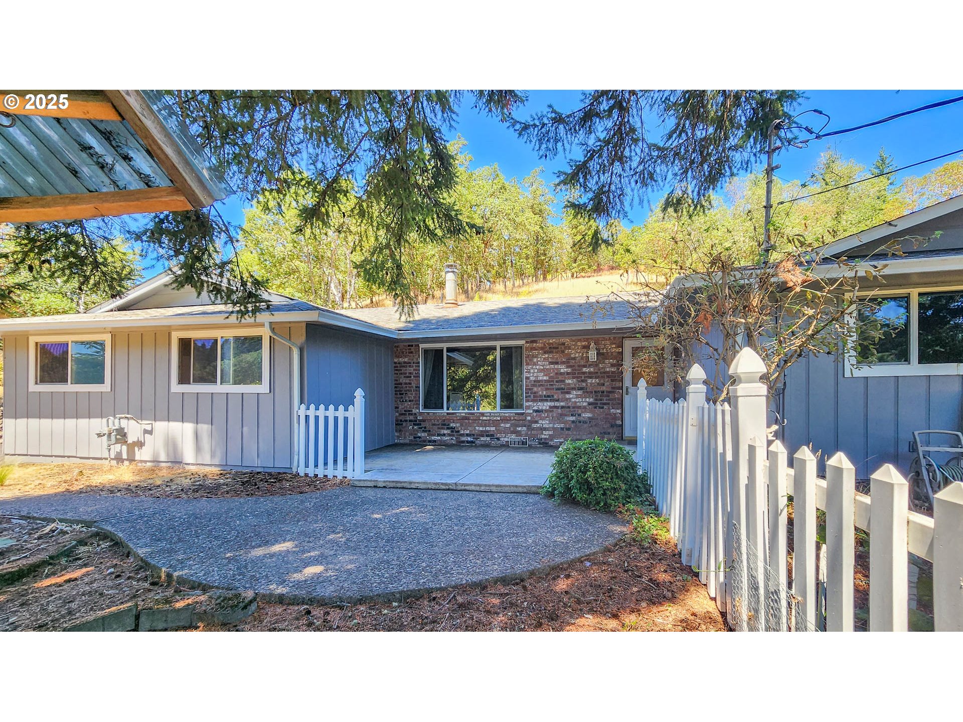 6649 Garden Valley Road Roseburg, OR 97471 - Photo 4 of 44 a view of a house with a patio