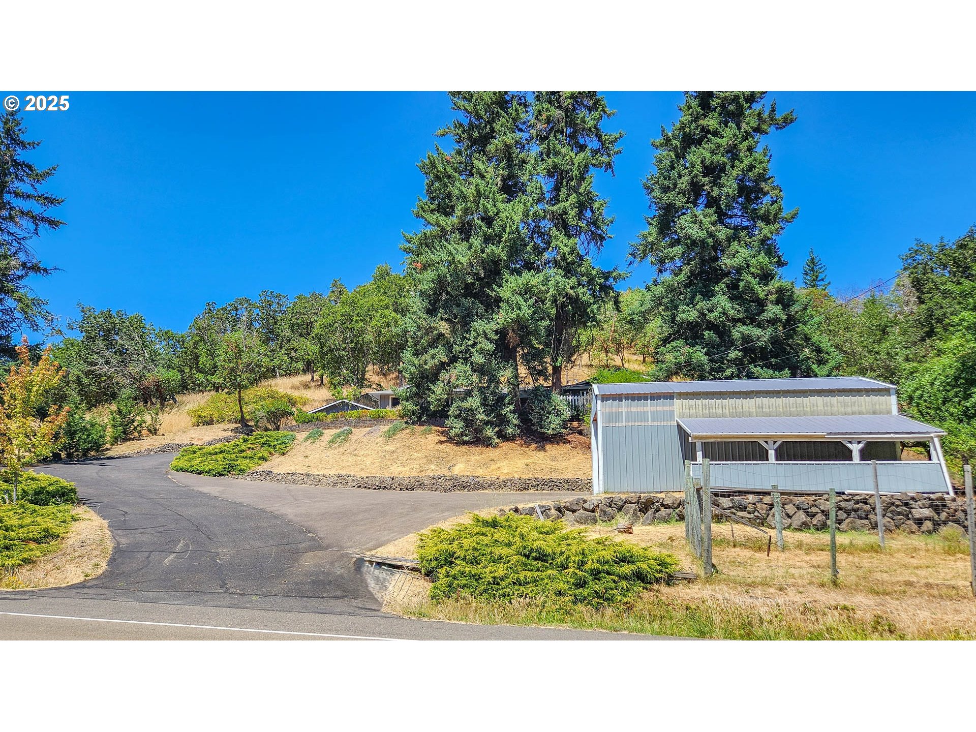 6649 Garden Valley Road Roseburg, OR 97471 - Photo 7 of 44 a view of a bench in the backyard