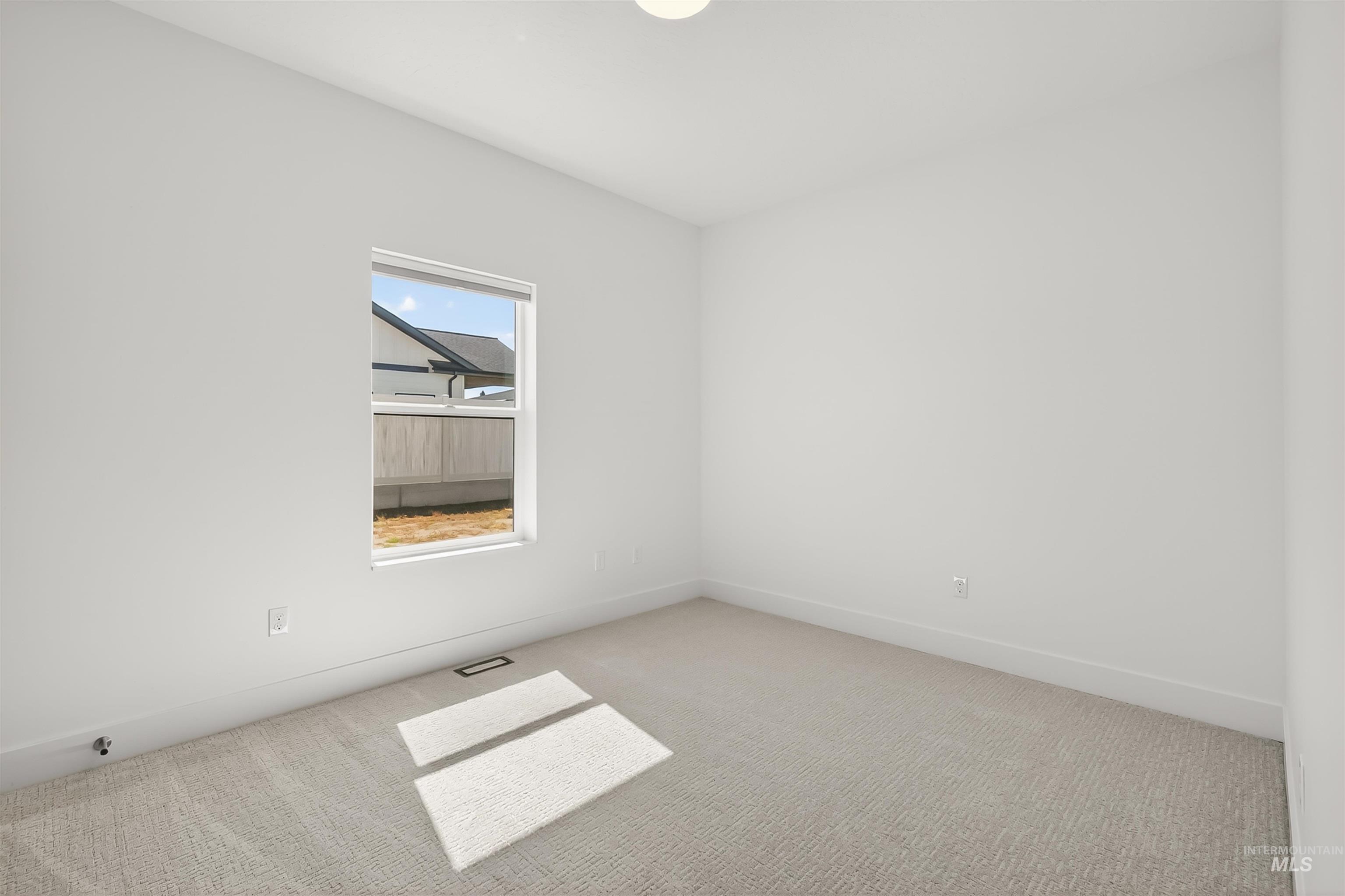 3710 22nd Street Lewiston, ID 83501 - Photo 8 of 36 Unfurnished room with light colored carpet and baseboards