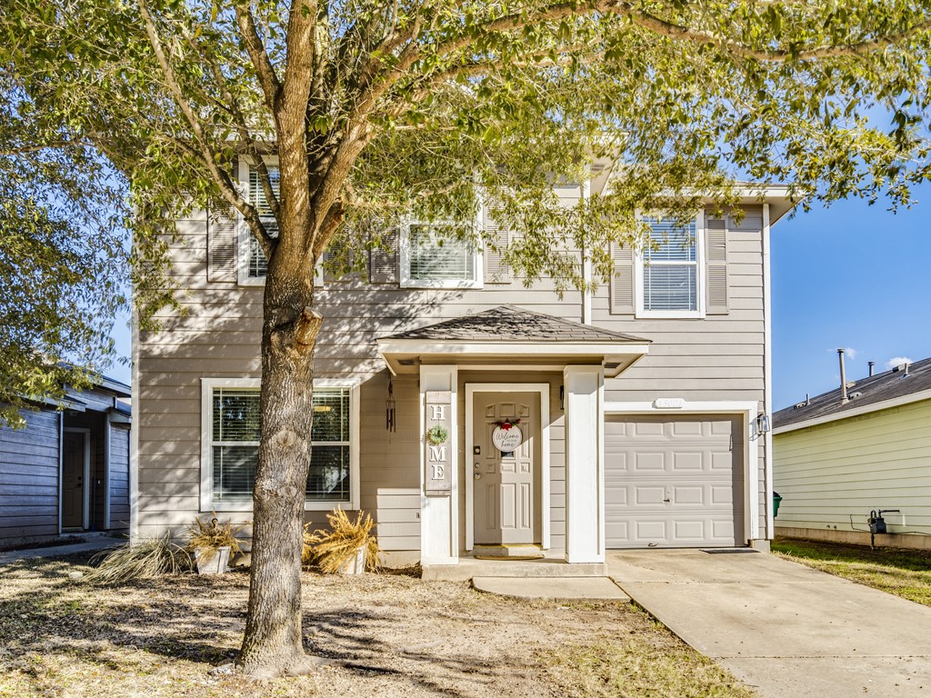 13021 Maidenhair Trail Elgin, TX 78621 - Photo 1 of 25 a front view of a house with a tree