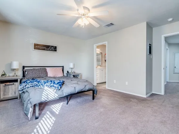 a bed room with a bed and a chandelier
