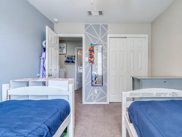 a en suite bathroom with a sink and a mirror