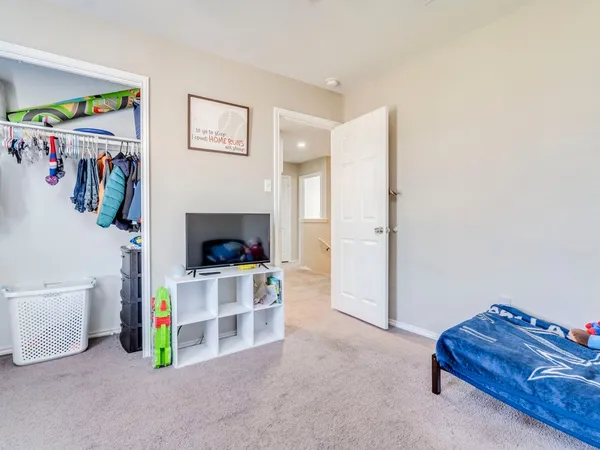 a living room with furniture and a bed