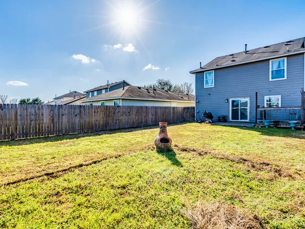 a swimming pool with wooden fence