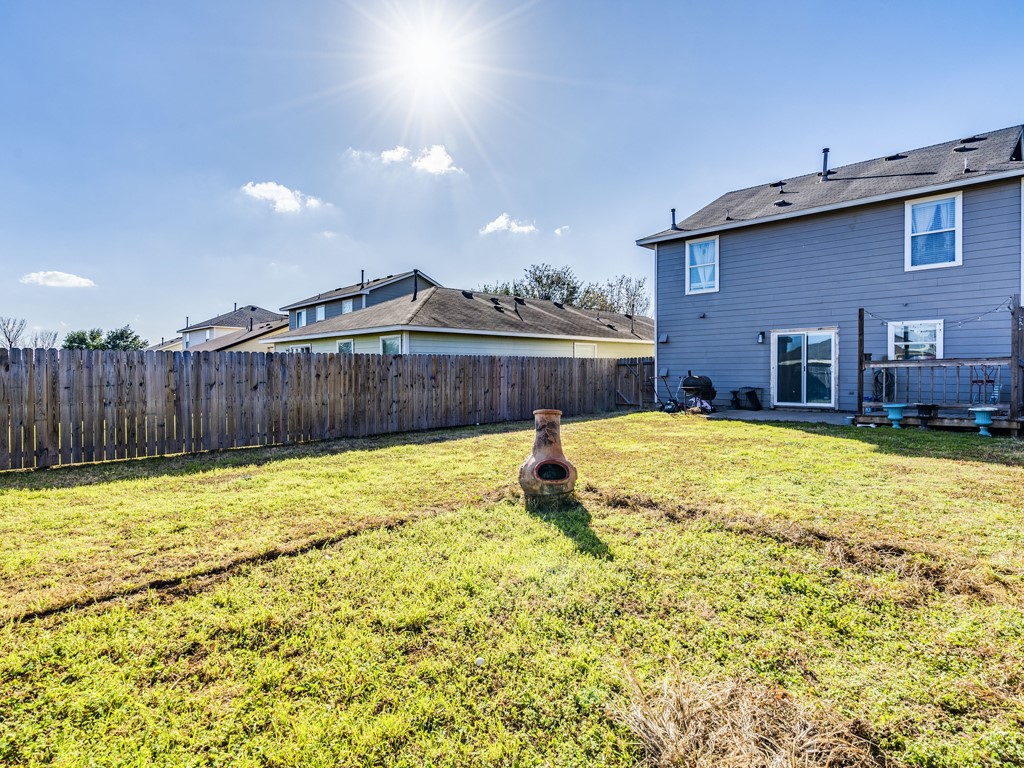 13021 Maidenhair Trail Elgin, TX 78621 - Photo 24 of 25 a swimming pool with wooden fence