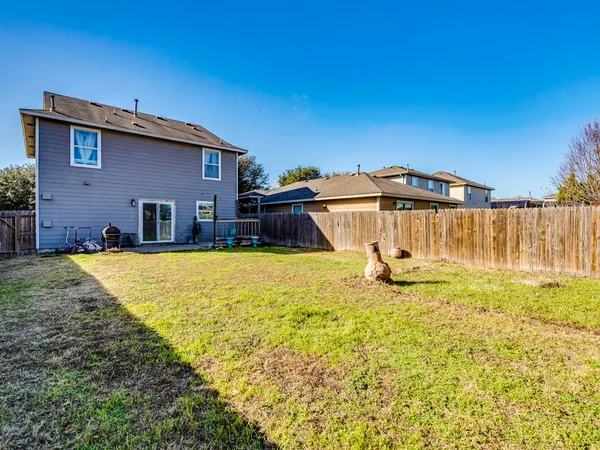 a house with swimming pool in front of it