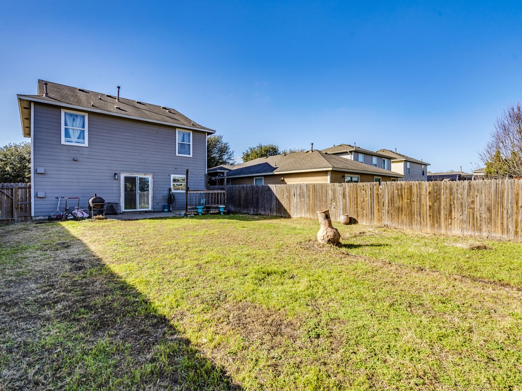 13021 Maidenhair Trail Elgin, TX 78621 - Photo 25 of 25 a house with swimming pool in front of it