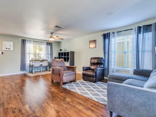 a living room with furniture and a large window