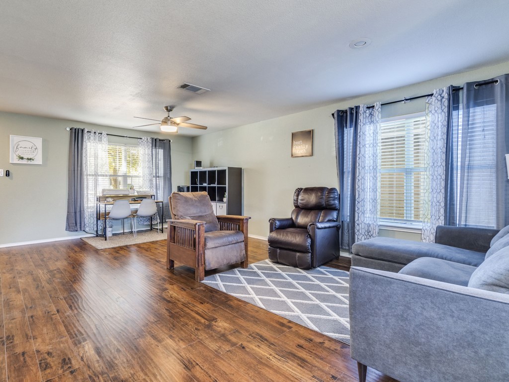 13021 Maidenhair Trail Elgin, TX 78621 - Photo 4 of 25 a living room with furniture and a large window