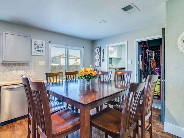 a dining room with furniture and window