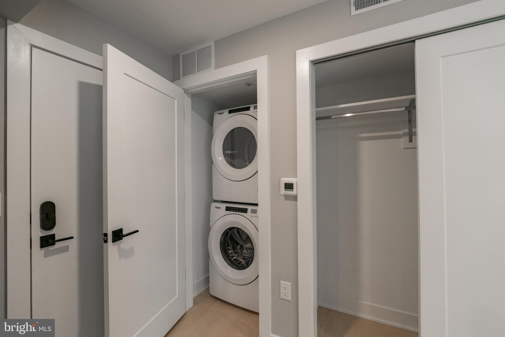 6604 Ridge Avenue, Unit 404 Philadelphia, PA 19128 - Photo 6 of 11 a utility room with dryer and washer