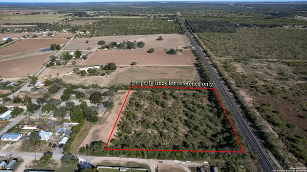an aerial view of residential house with parking space