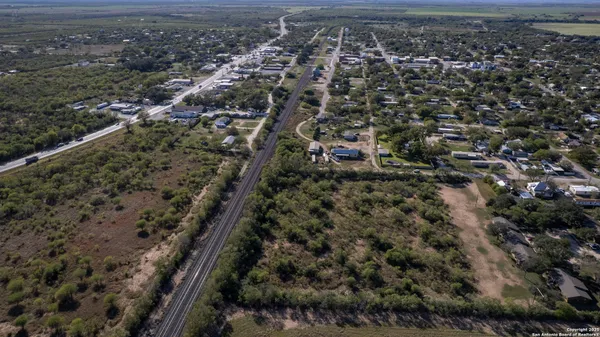 a view of a forest with a street