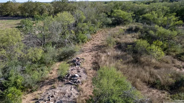 a view of a building in a field