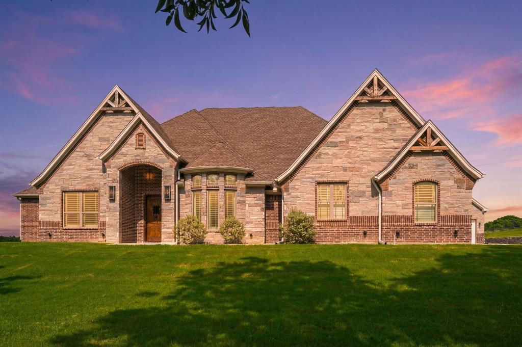318 Arapahoe Ridge Weatherford, TX 76087 - Photo 3 of 40 Front of home with twilight.