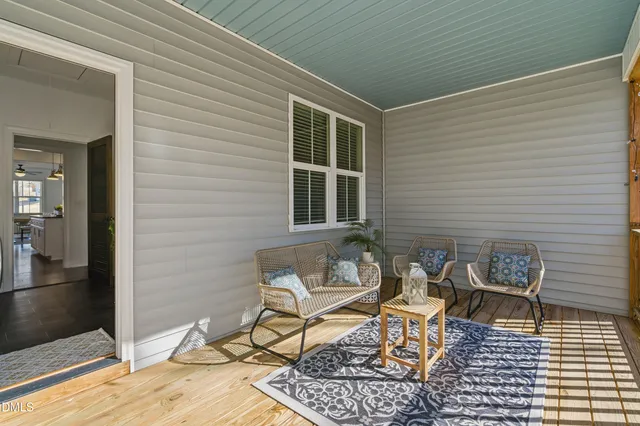 a view of wooden fence and trees