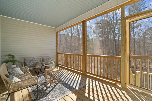 a view of a house with a snow on the road
