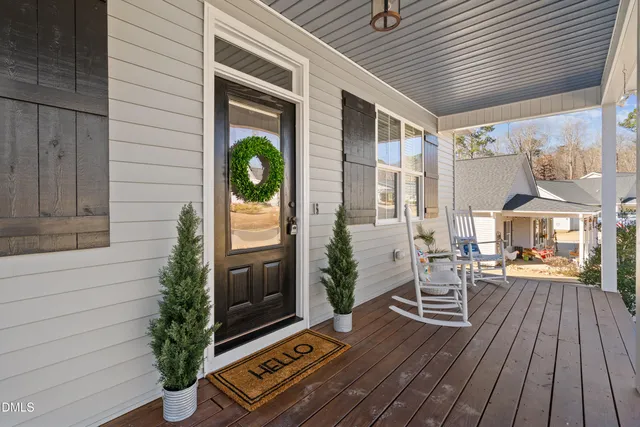 a porch with seating space and yard