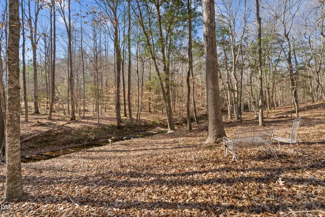 a view of a backyard of the house