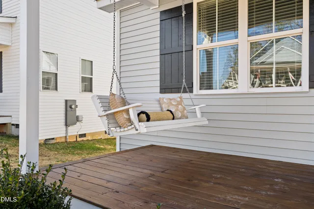 a view of a house with backyard and deck