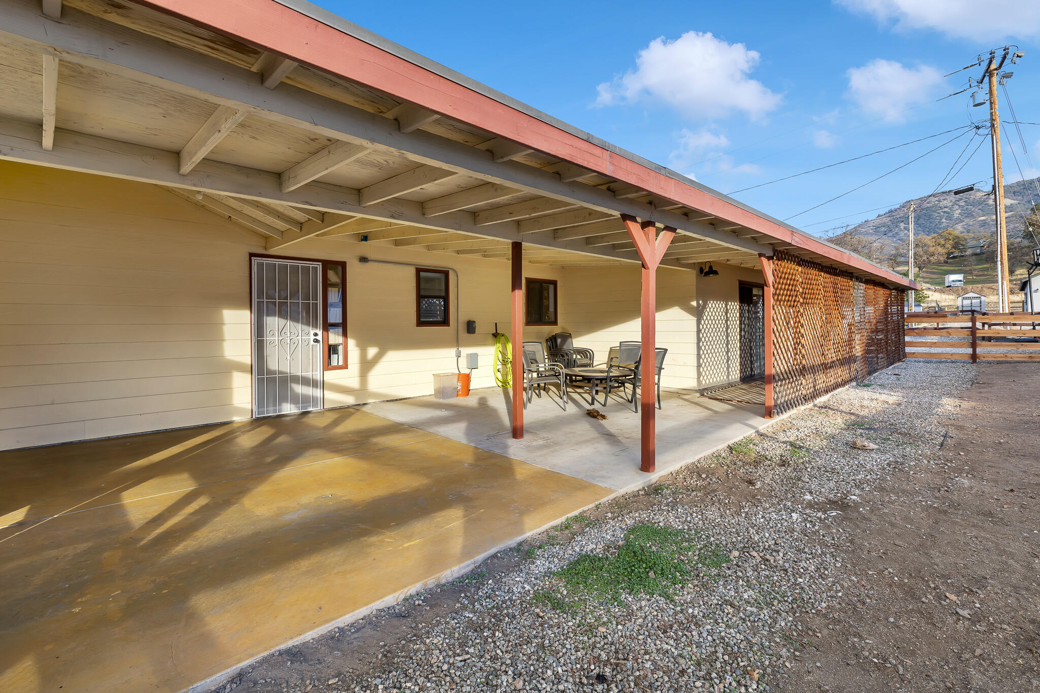 17681 Busher Way Tehachapi, CA 93561 - Photo 11 of 54 a view of a patio with table and chairs