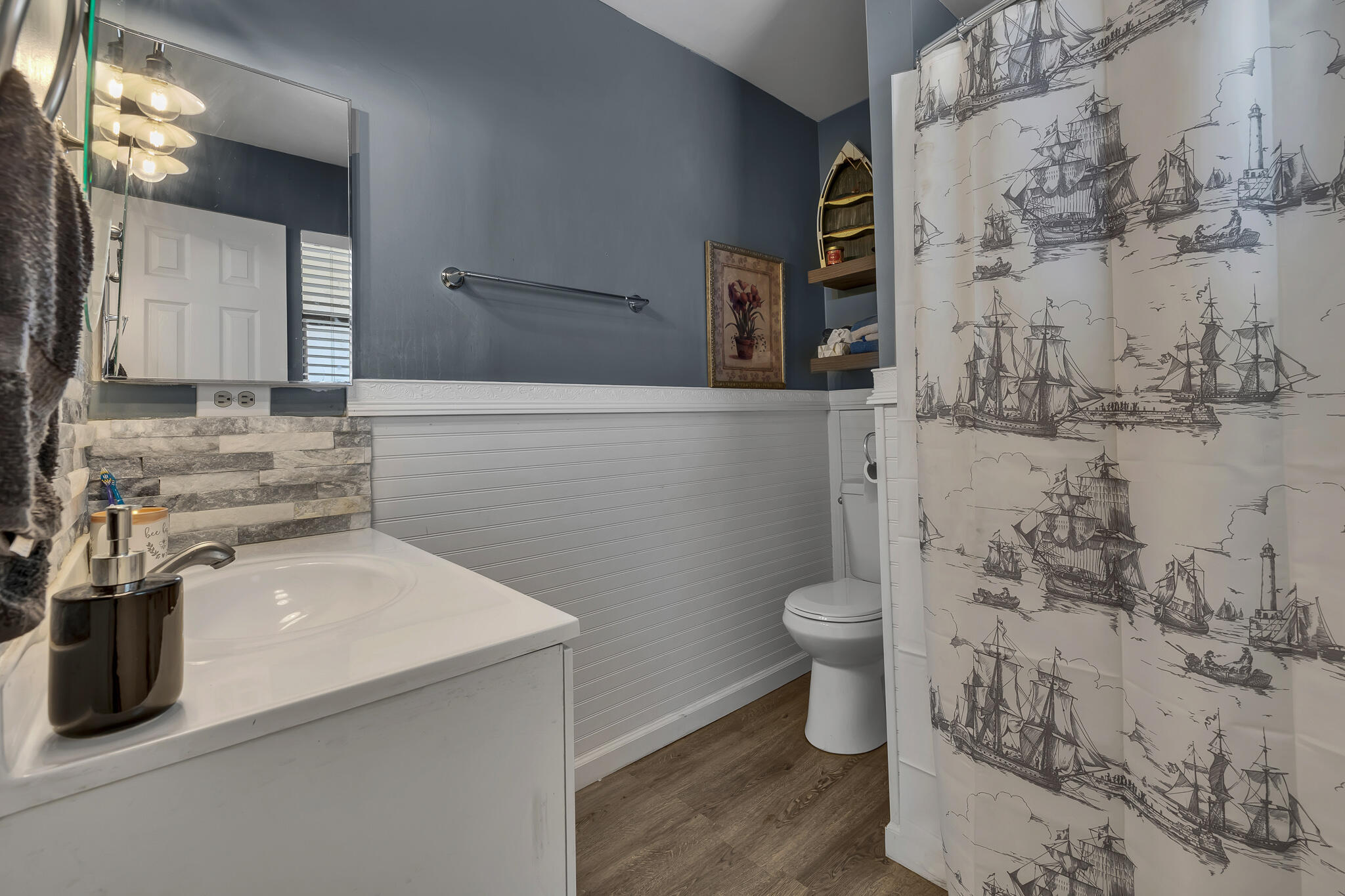 17681 Busher Way Tehachapi, CA 93561 - Photo 13 of 54 a bathroom with a sink a toilet and shower