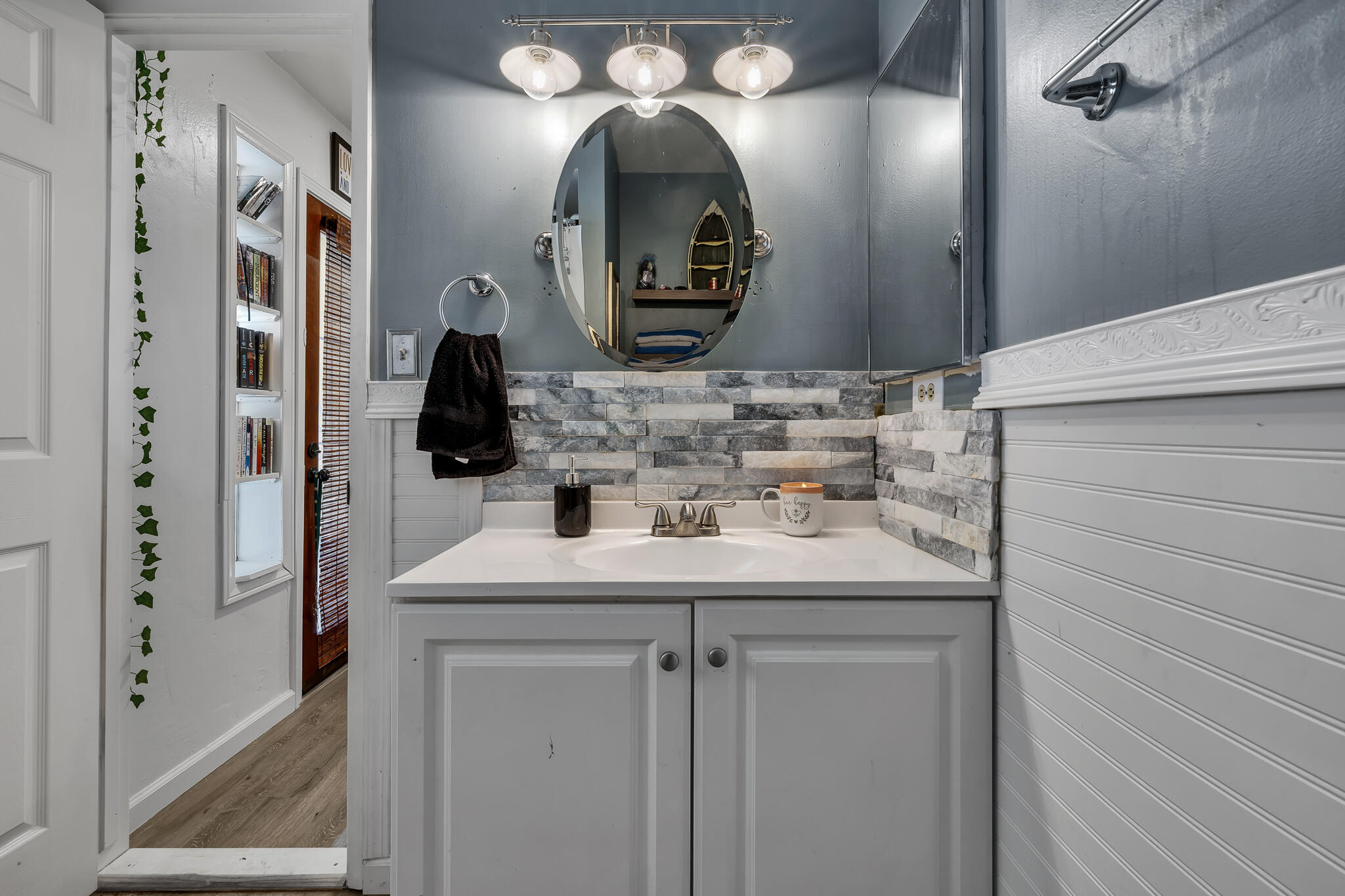 17681 Busher Way Tehachapi, CA 93561 - Photo 14 of 54 a bathroom with double vanity sink and a mirror
