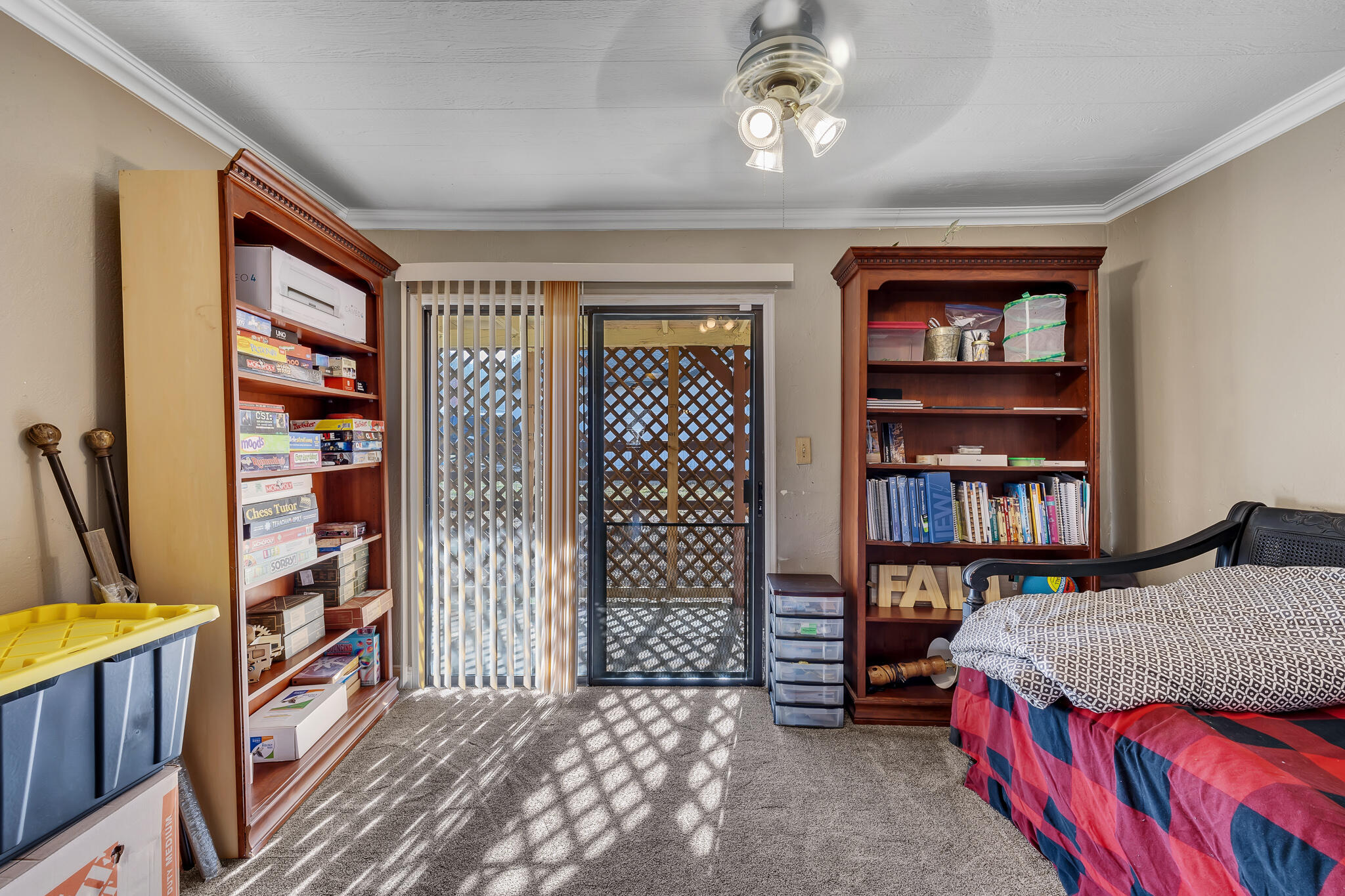 17681 Busher Way Tehachapi, CA 93561 - Photo 19 of 54 a bedroom with a bed furniture and a book shelf
