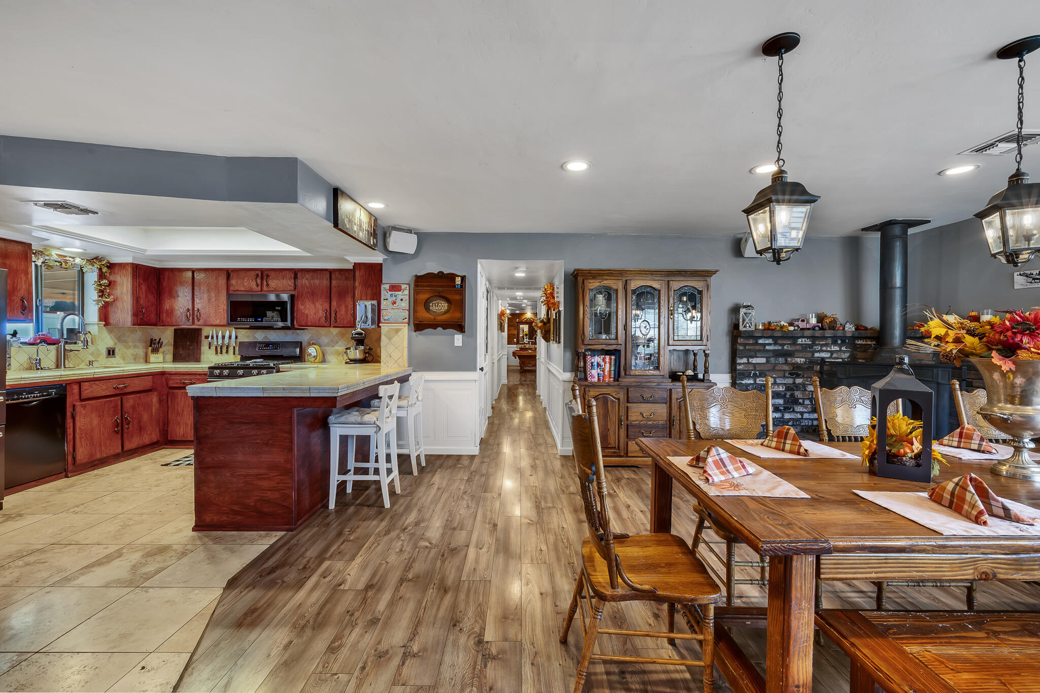 17681 Busher Way Tehachapi, CA 93561 - Photo 21 of 54 a living room with stainless steel appliances granite countertop furniture wooden floor kitchen view and a chandelier
