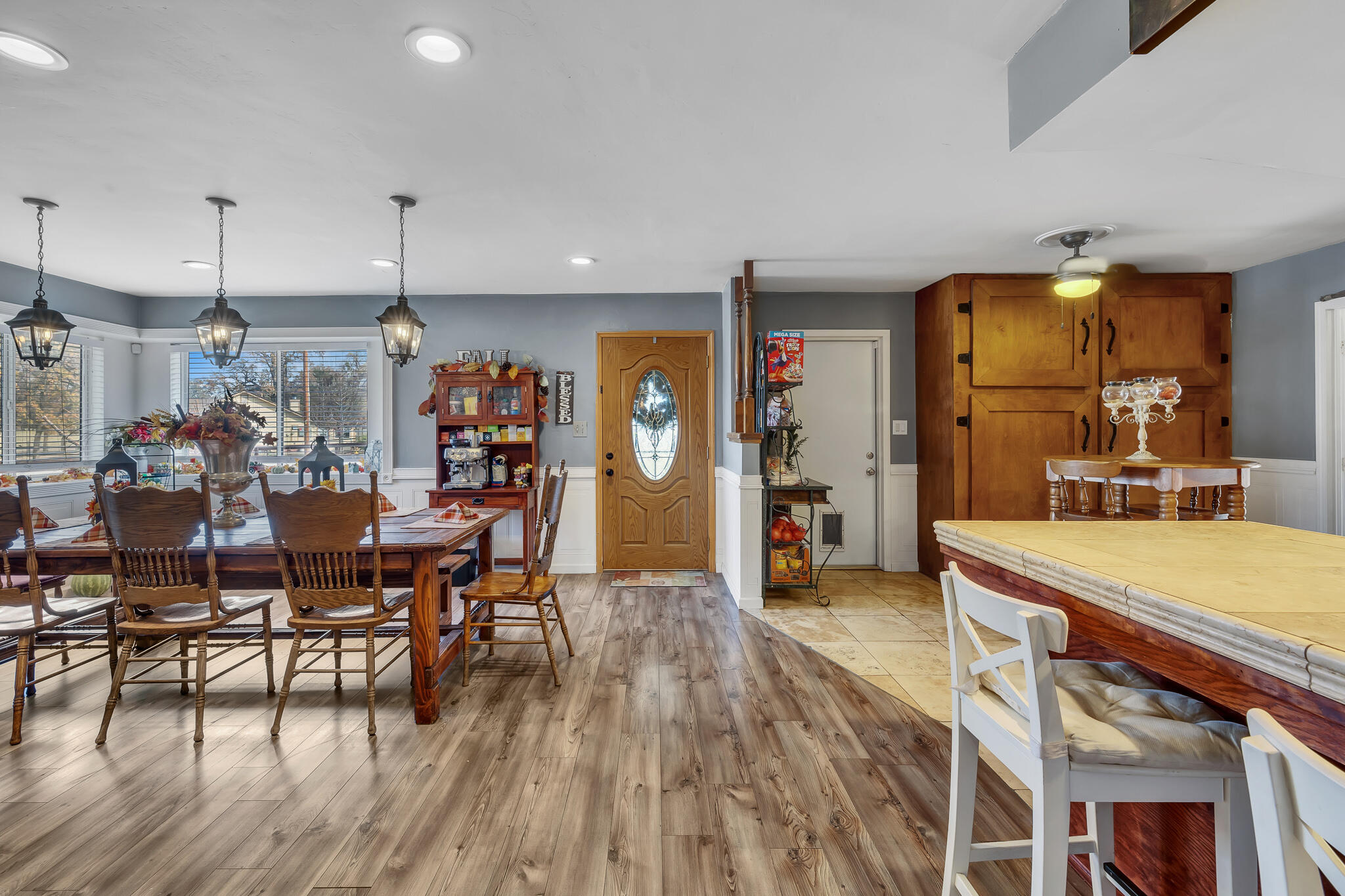 17681 Busher Way Tehachapi, CA 93561 - Photo 23 of 54 a view of a dining room and livingroom with furniture wooden floor a chandelier
