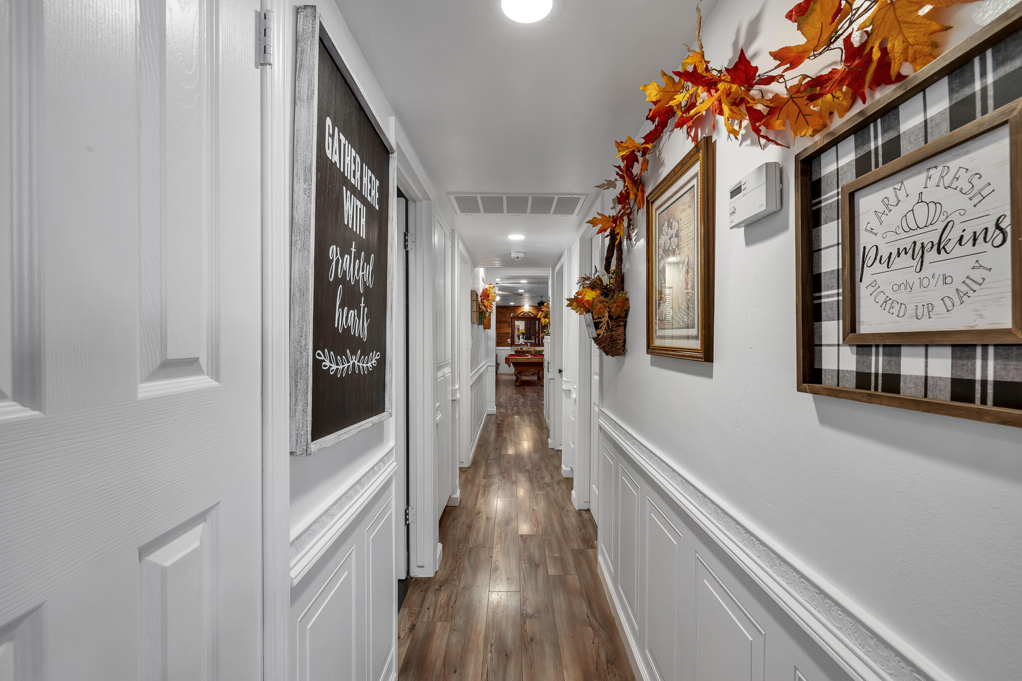 17681 Busher Way Tehachapi, CA 93561 - Photo 32 of 54 a view of a hallway with wooden floor and stairs