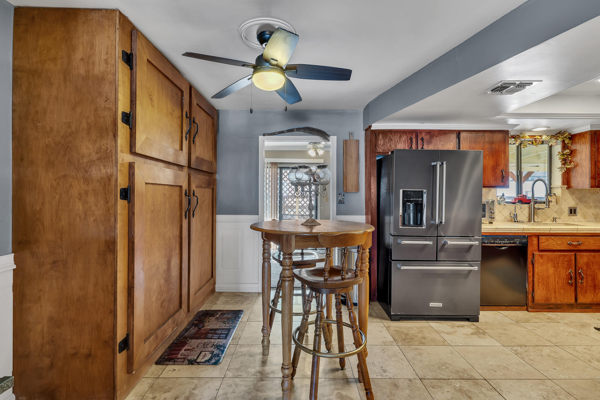 17681 Busher Way Tehachapi, CA 93561 - Photo 35 of 54 a kitchen with stainless steel appliances granite countertop a sink a stove and a refrigerator